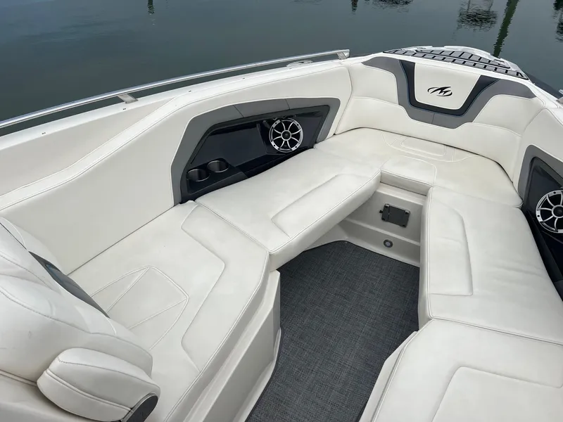 Slide: The Image of 2014 Monterey 288 SS boat interior with white leather seating and built-in speakers. - 9