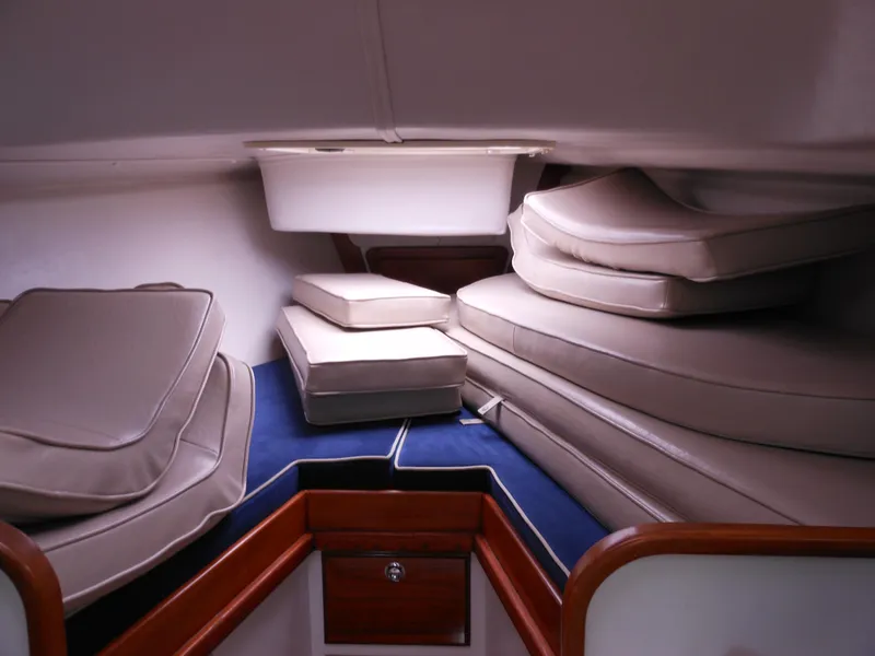 Slide: The Image of Interior cabin of 2009 Alerion Express 33 sailboat with stacked cushions. - 16