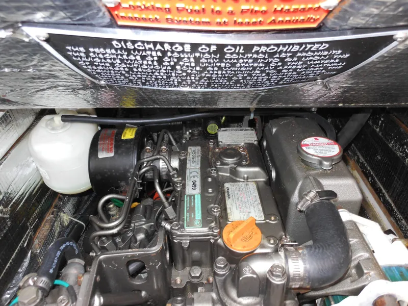 Slide: The Image of Engine compartment of a 2009 Alerion Express 33 sailboat, featuring detailed mechanical components. - 18