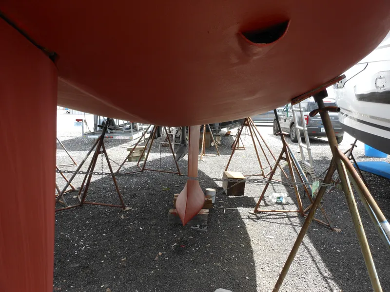 Slide: The Image of 2009 Alerion Express 33 sailboat hull on stands in a boatyard. - 19