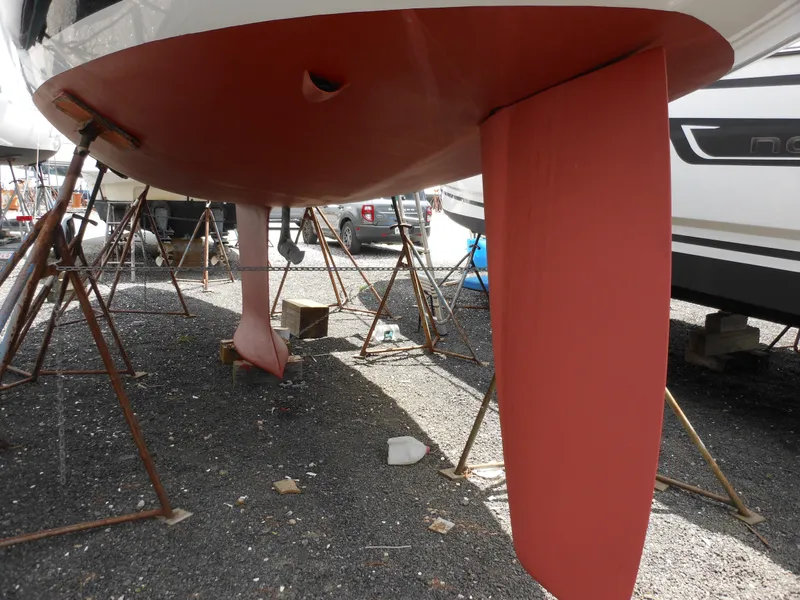 Slide: The Image of 2009 Alerion Express 33 sailboat hull and rudder on dry dock. - 20