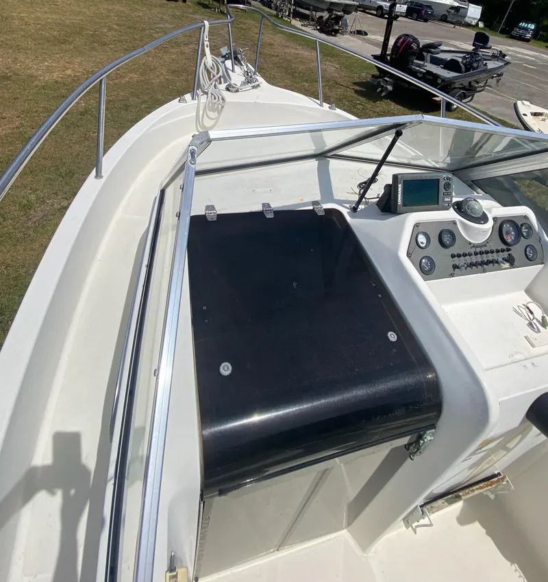 Slide: The Image of 1999 Aquasport 245 Explorer boat deck and control panel. - 24