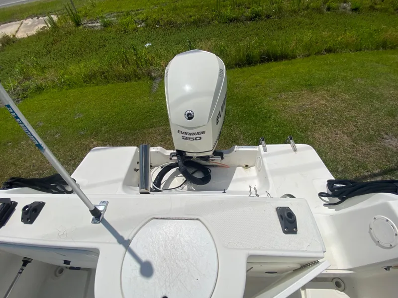 Slide: The Image of 1999 Aquasport 245 Explorer boat with Evinrude 250 outboard motor. - 8