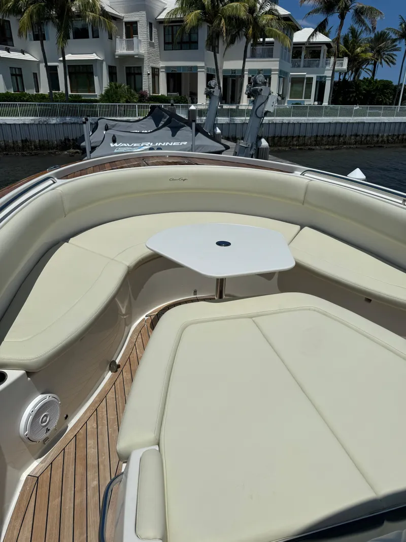 Slide: The Image of 2016 Chris-Craft Catalina 34 boat with cushioned seating and table. - 10