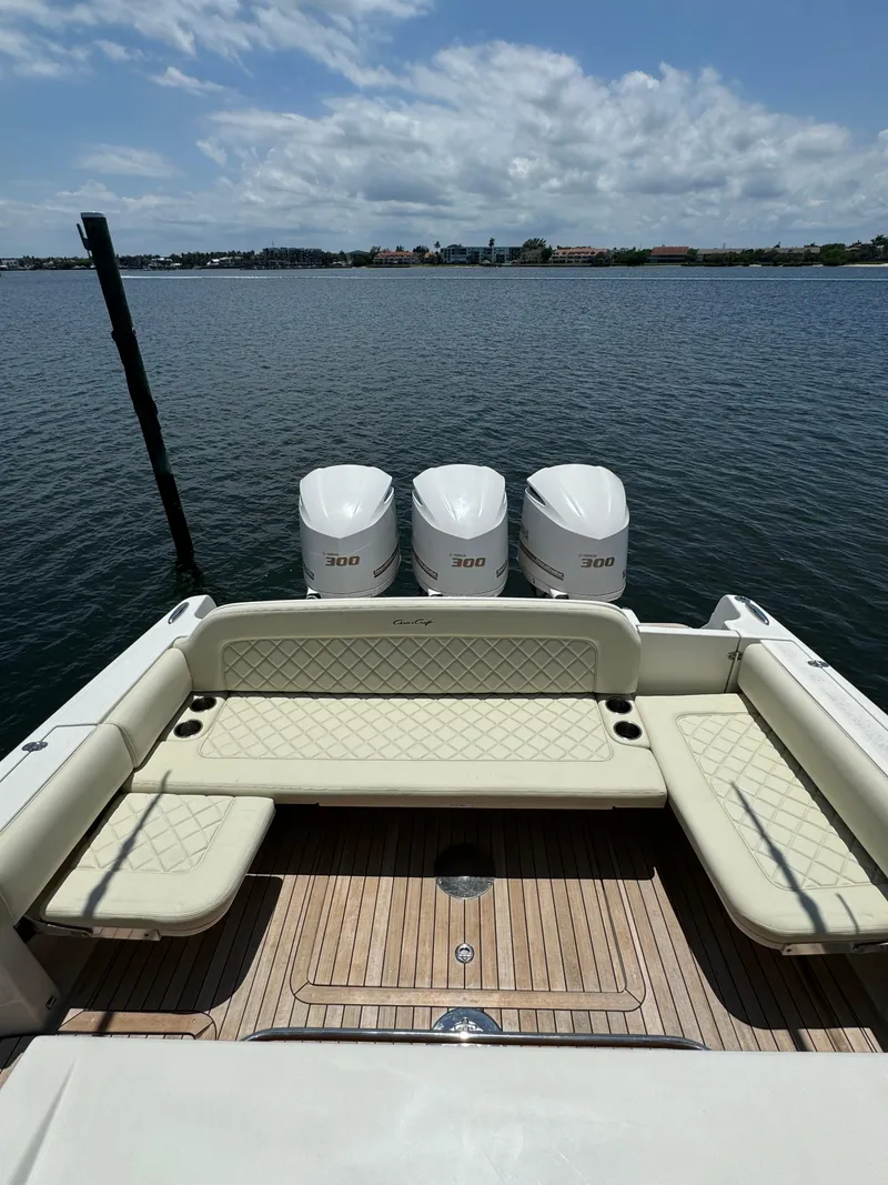 Slide: The Image of 2016 Chris-Craft Catalina 34 boat with triple outboard engines on calm water. - 3