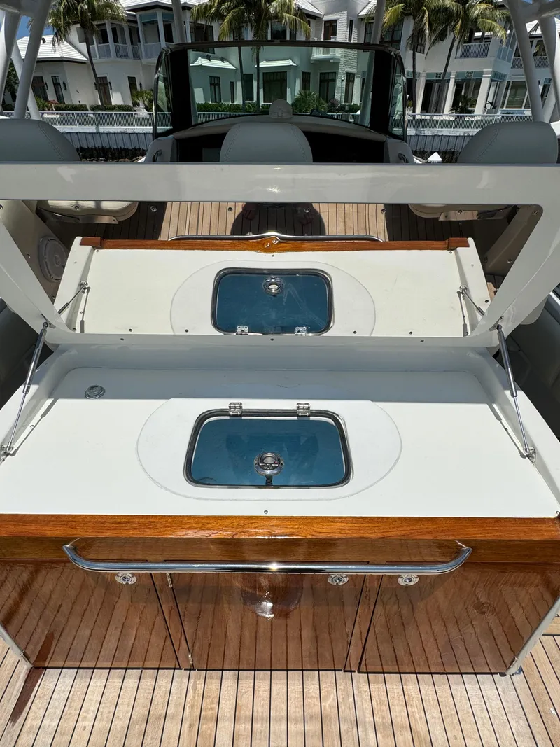 Slide: The Image of 2016 Chris-Craft Catalina 34 boat with a sleek onboard sink and storage area. - 5
