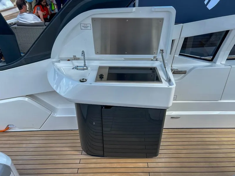 Slide: The Image of 2023 Fairline F//Line 33 Outboard yacht with an open outdoor kitchenette. - 18
