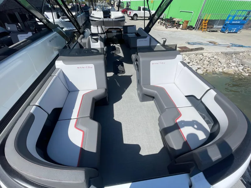 Slide: The Image of 2024 Manitou Cruise boat interior with spacious seating and modern design. - 2