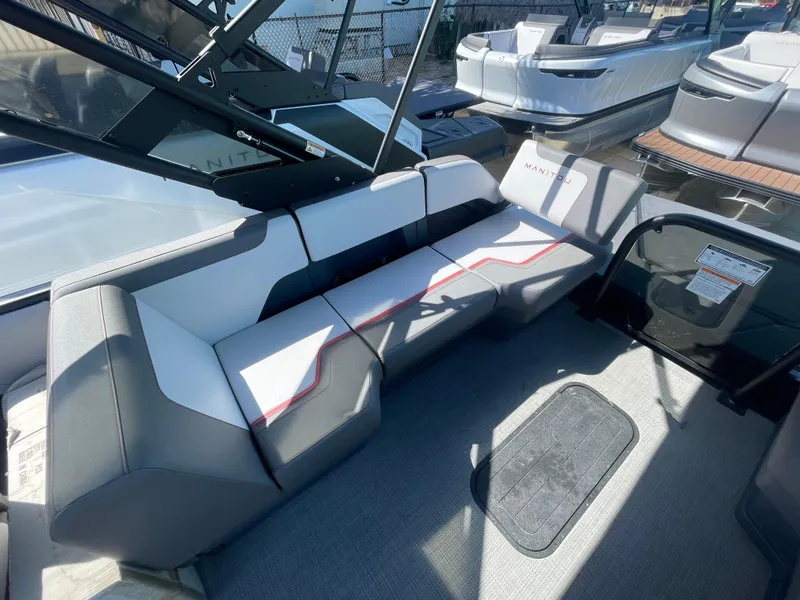 Slide: The Image of 2024 Manitou Cruise boat interior with modern seating and sleek design. - 5