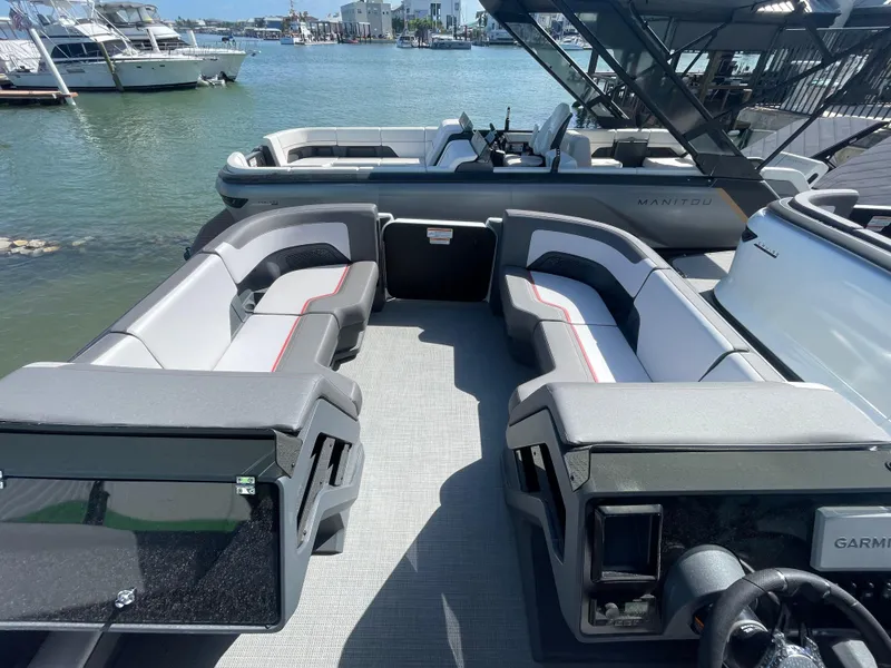 Slide: The Image of 2024 Manitou Cruise boat interior with spacious seating and waterfront view. - 6