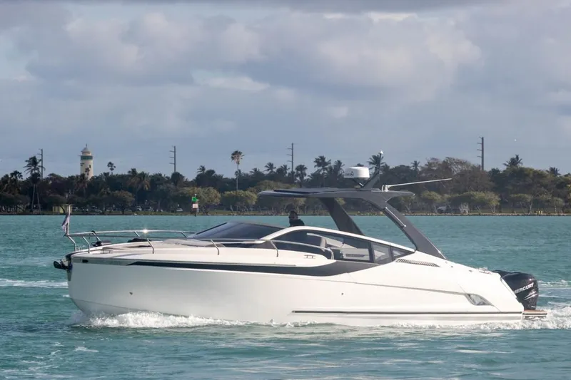 Slide: The Image of 2023 Fairline F//Line 33 Outboard cruising on a scenic waterway. - 3