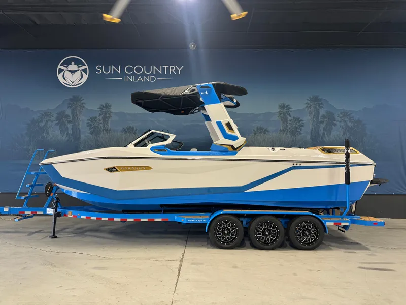 The Image of 2025 Nautique Super Air Nautique G25 Paragon boat on trailer at Sun Country Inland showroom. - 1