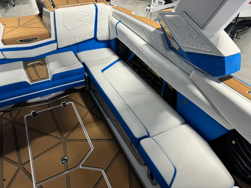Slide: The Image of Interior of 2025 Nautique Super Air Nautique G25 Paragon with blue and white seating. - 10