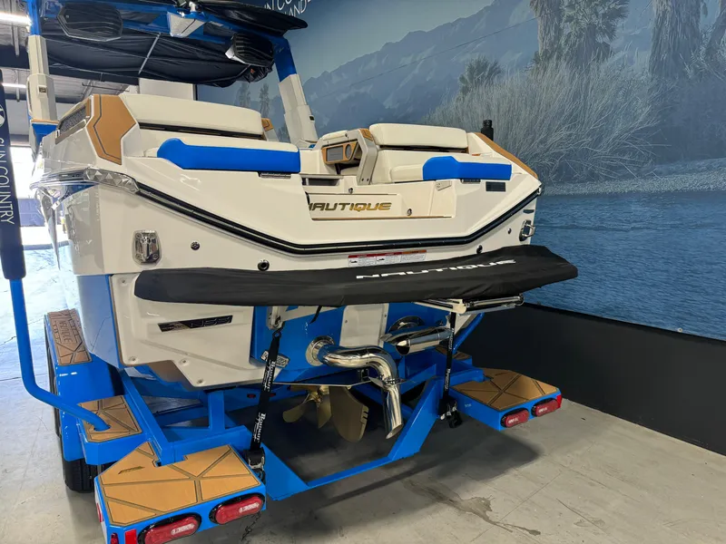 Slide: The Image of 2025 Nautique Super Air Nautique G25 Paragon boat rear view in showroom. - 4