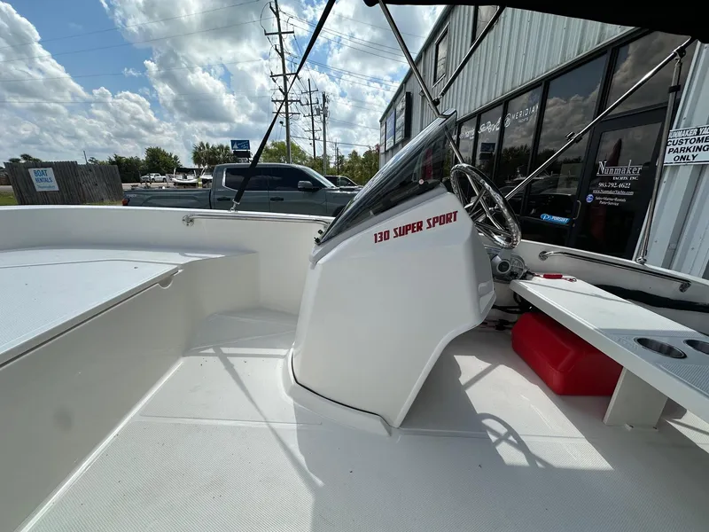 Slide: The Image of 2024 Boston Whaler 130 Super Sport boat interior with steering console. - 10