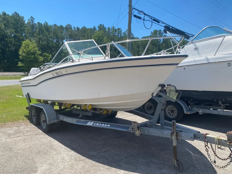 The Image of 1988 Grady-White 190 Tournament boat on trailer in outdoor setting. - 1