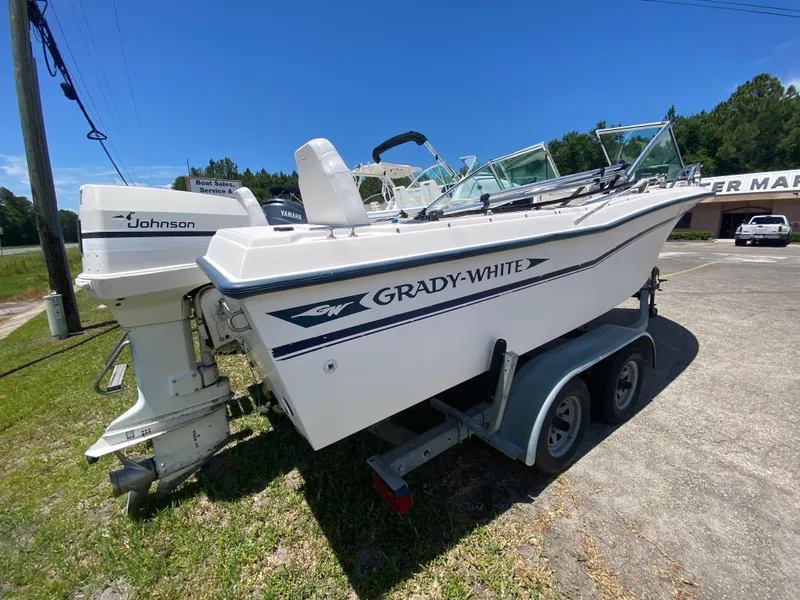 Slide: The Image of 1988 Grady-White 190 Tournament boat on a trailer with Johnson outboard motor. - 3