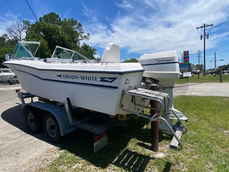 Slide: The Image of 1988 Grady-White 190 Tournament boat on trailer with Johnson outboard motor. - 4