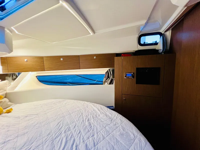 Slide: The Image of Interior cabin of 2021 Jeanneau NC Weekender 1095 with bed and storage cabinets. - 29