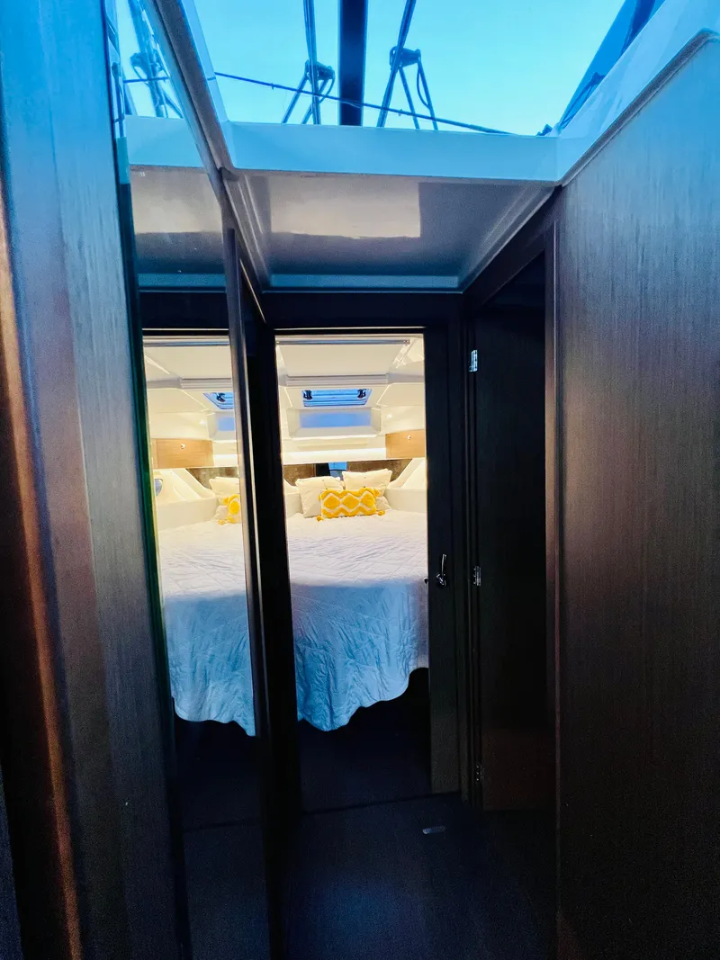 Slide: The Image of 2021 Jeanneau NC Weekender 1095 cabin interior with bed and skylight. - 31