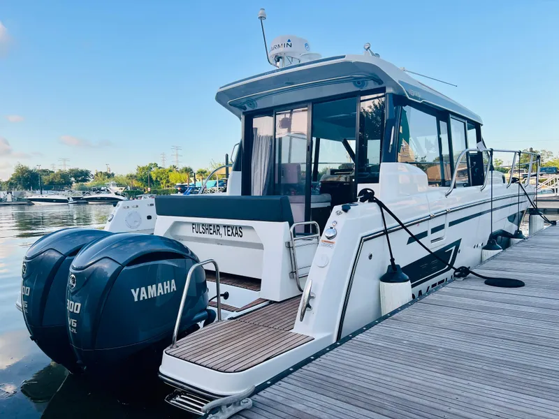 Slide: The Image of 2021 Jeanneau NC Weekender 1095 docked with twin Yamaha engines. - 6