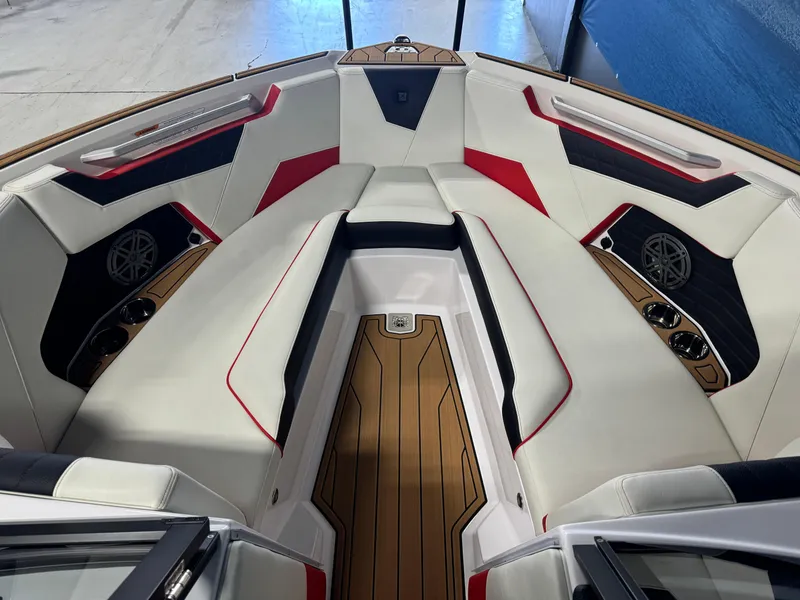 Slide: The Image of 2025 Nautique Super Air S25 boat interior with stylish seating and modern design. - 14