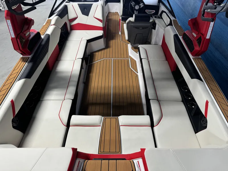 Slide: The Image of 2025 Nautique Super Air S25 interior with spacious seating and sleek design. - 5