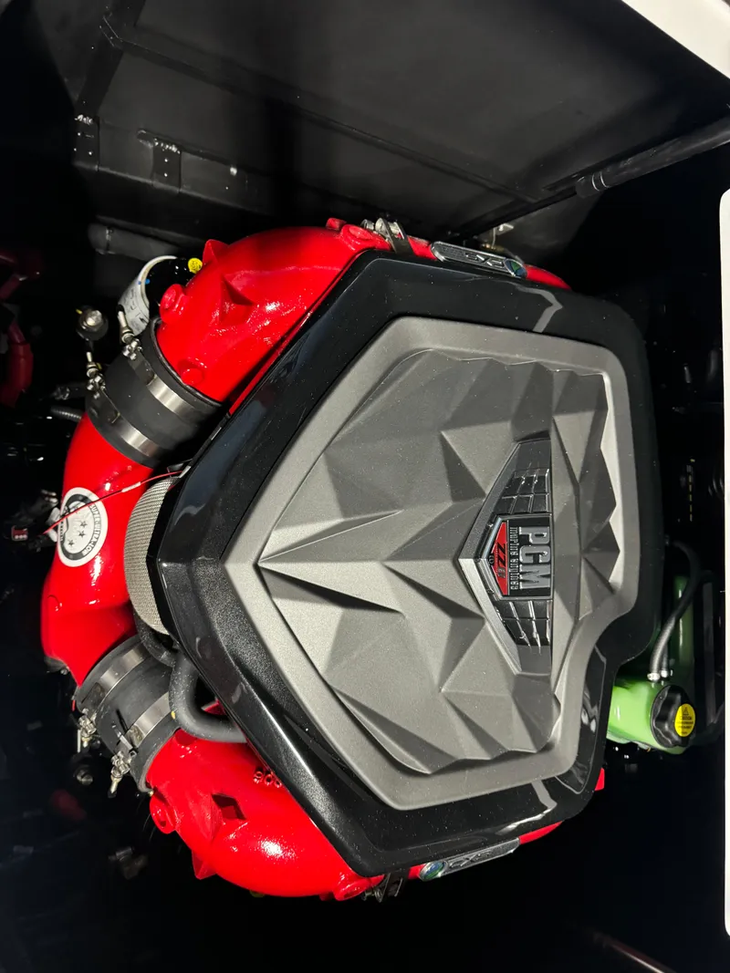 Slide: The Image of 2025 Nautique Super Air S25 engine, featuring a sleek red and black design. - 7