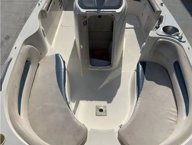 Slide: The Image of 1997 Regal 200 DESTINY boat interior with seating and storage compartments. - 11