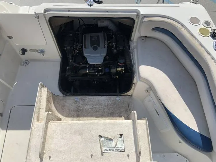 Slide: The Image of 1997 Regal 200 DESTINY boat engine compartment with seating area. - 12