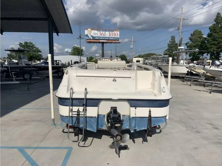 Slide: The Image of 1997 Regal 200 DESTINY boat in a marina parking lot. - 7