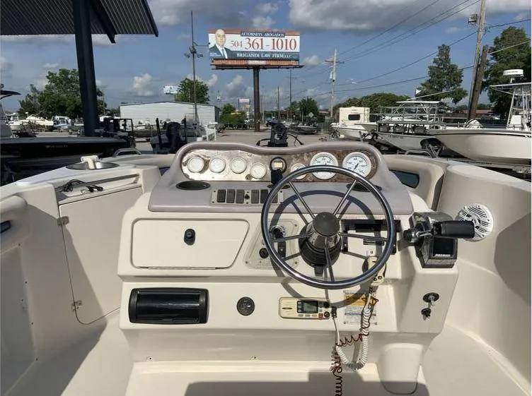 Slide: The Image of 1997 Regal 200 DESTINY boat dashboard with steering wheel and gauges. - 9