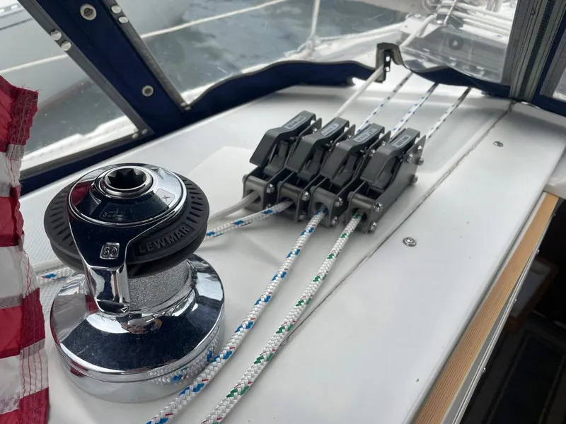 Slide: The Image of Winch and rope clutches on a 2000 Catalina 310 sailboat deck. - 19