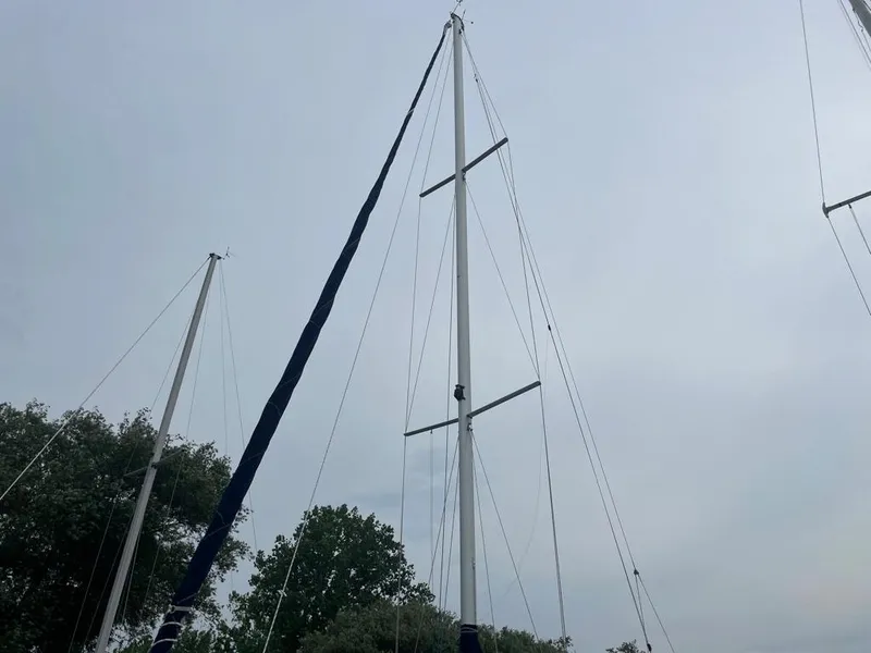 Slide: The Image of Tall mast of a 2000 Catalina 310 sailboat against a cloudy sky. - 5