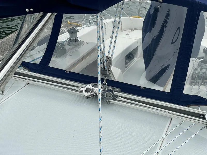 Slide: The Image of Sailboat cockpit view of a 2000 Catalina 310 with ropes and winch. - 9