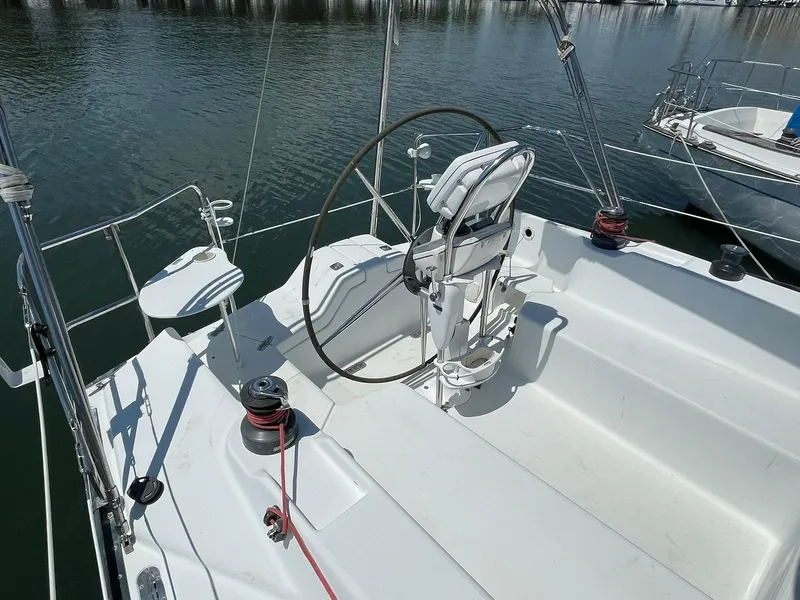 Slide: The Image of 2001 C&C 110 sailboat cockpit with steering wheel and winches. - 10