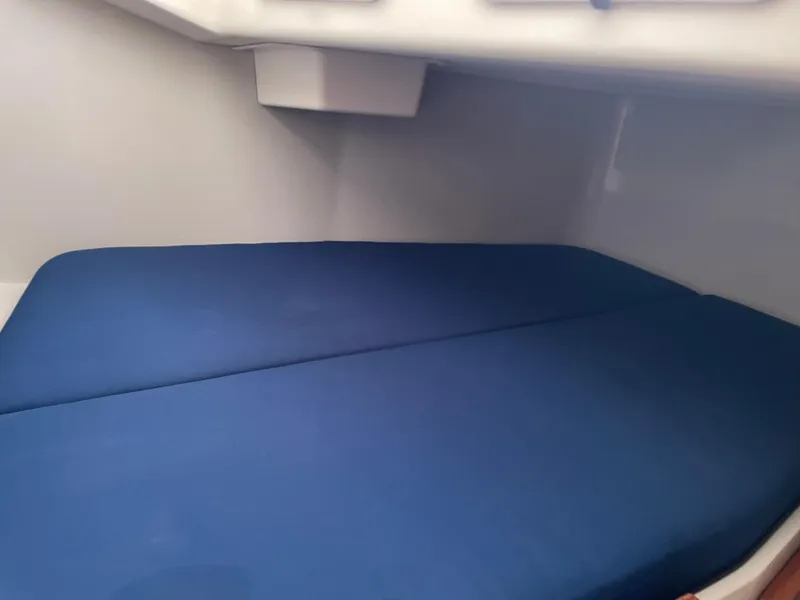 Slide: The Image of Interior cabin bed with blue mattress in 2001 C&C 110 sailboat. - 28