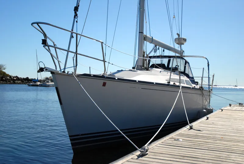 Slide: The Image of C&C 110 sailboat docked, 2001 model, calm waters, clear sky. - 3