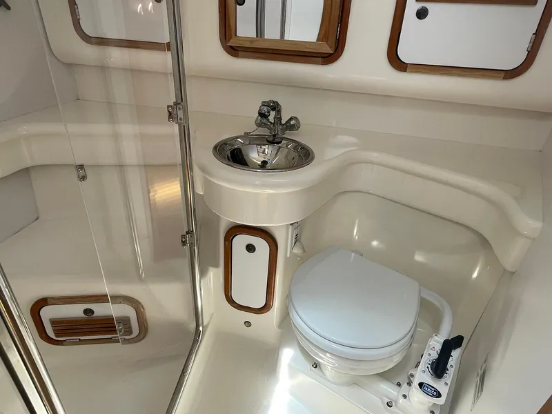 Slide: The Image of Compact bathroom in a 2001 C&C 110 sailboat with sink and toilet. - 31