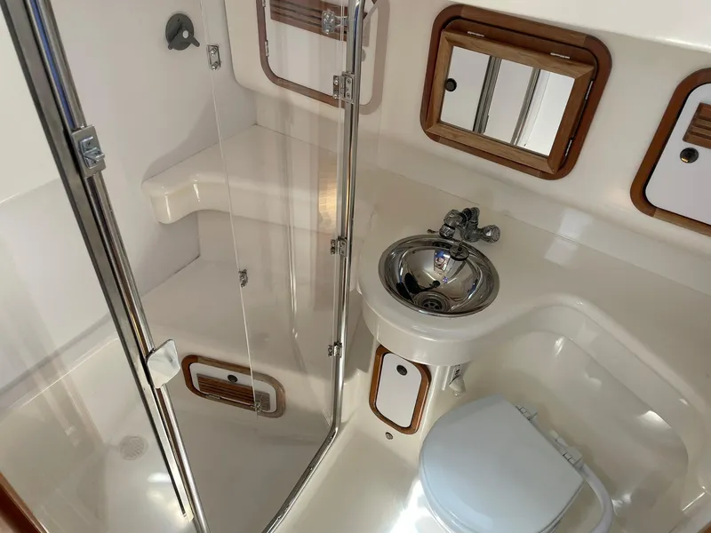Slide: The Image of Compact bathroom in a 2001 C&C 110 sailboat with shower, sink, and toilet. - 32