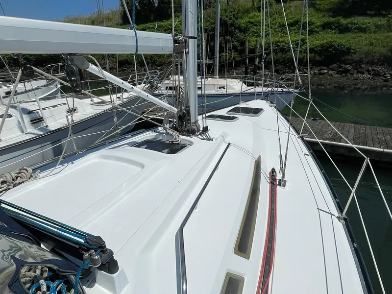 Slide: The Image of 2001 C&C 110 sailboat deck with rigging and dock in background. - 6