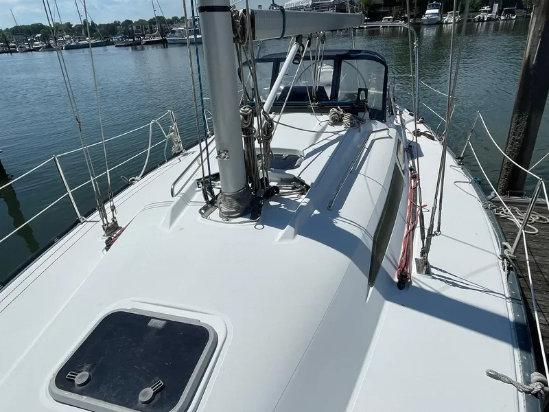 Slide: The Image of 2001 C&C 110 sailboat docked at a marina. - 8