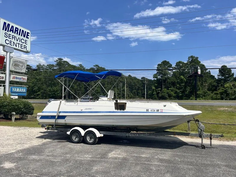 The Image of 1995 Hurricane FunDeck 240 boat on trailer at Marine Service Center. - 1