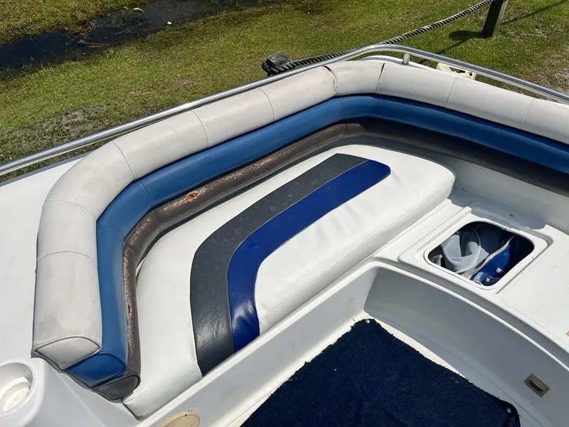 Slide: The Image of 1995 Hurricane FunDeck 240 boat interior with seating, cup holder, and railing. - 9