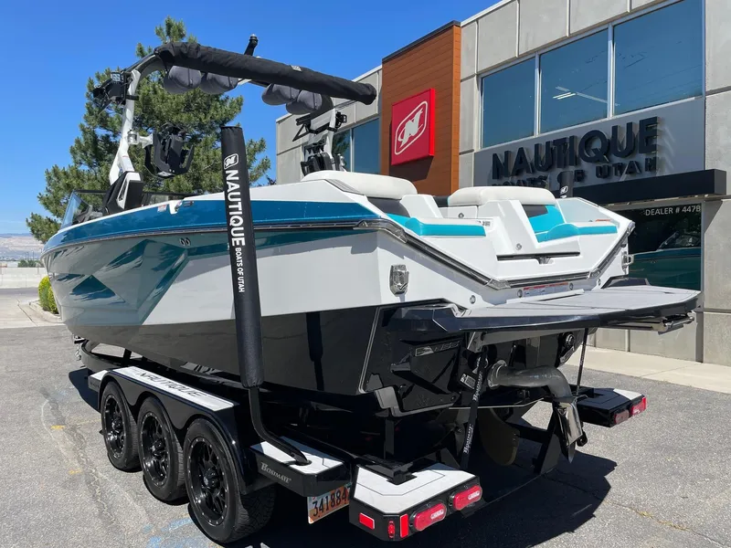 Slide: The Image of 2021 Nautique Super Air Nautique G25 boat on trailer outside dealership. - 4