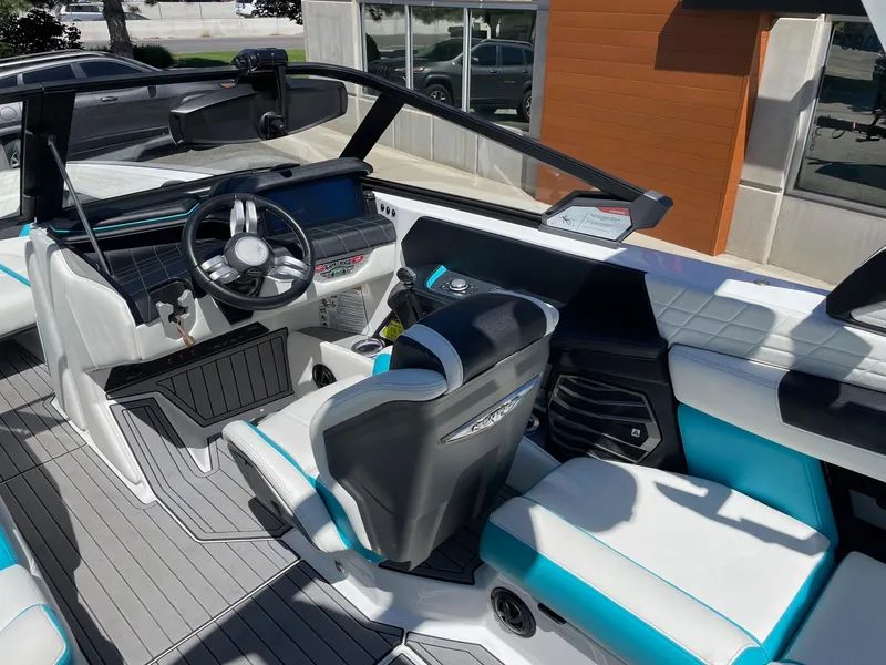 Slide: The Image of 2021 Nautique Super Air Nautique G25 boat interior with modern dashboard and seating. - 8