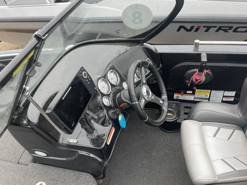 Slide: The Image of 2019 Nitro ZV19 Sport boat dashboard and steering wheel. - 10