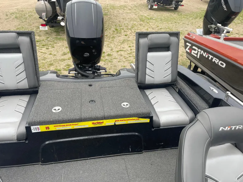 Slide: The Image of 2019 Nitro ZV19 Sport boat interior with seating and motor. - 12