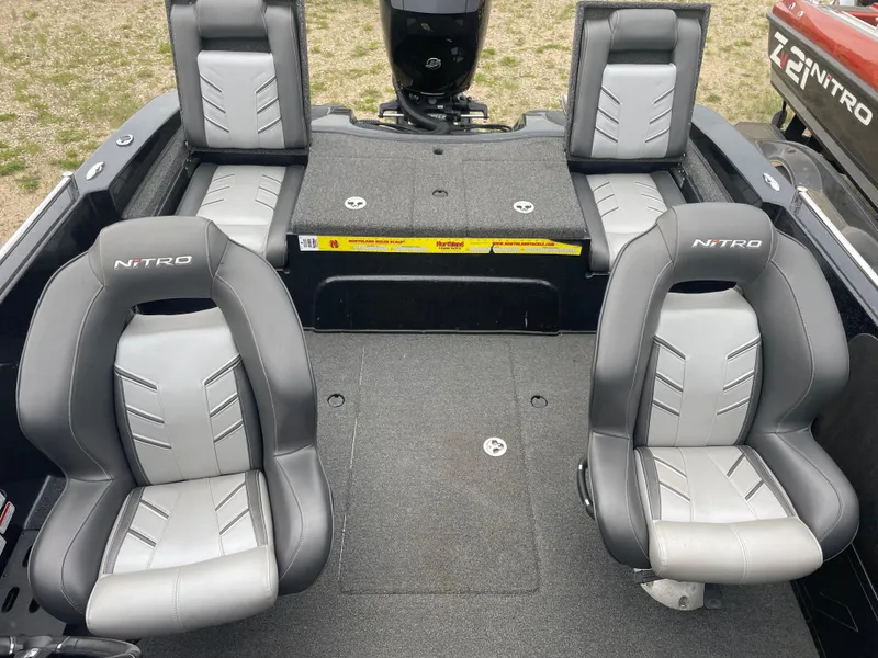Slide: The Image of 2019 Nitro ZV19 Sport boat interior with gray seating and ample deck space. - 19