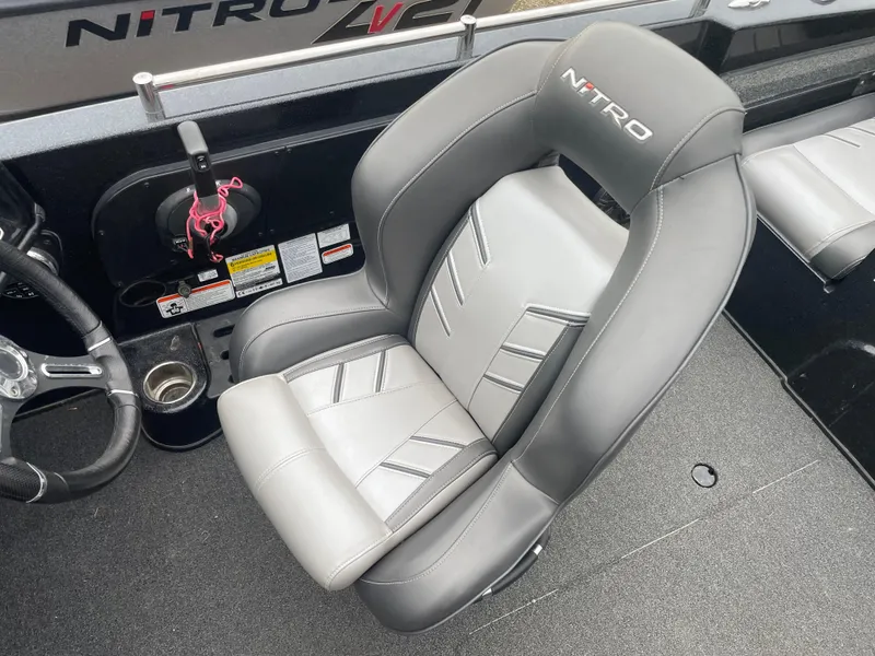 Slide: The Image of 2019 Nitro ZV19 Sport boat interior with gray and white captain's chair. - 9